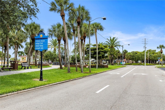 2104 Batello Dr, Venice, FL 34292 - view of asphalt street with street lights, curbs, and traffic signs