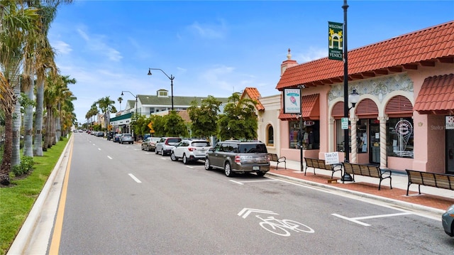 2104 Batello Dr, Venice, FL 34292 - view of asphalt road featuring street lights, curbs, and sidewalks