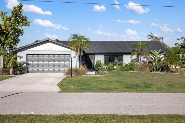 5140 Administration St, Port Charlotte, FL 33948 - ranch-style home featuring an attached garage, driveway, a front yard, and stucco siding