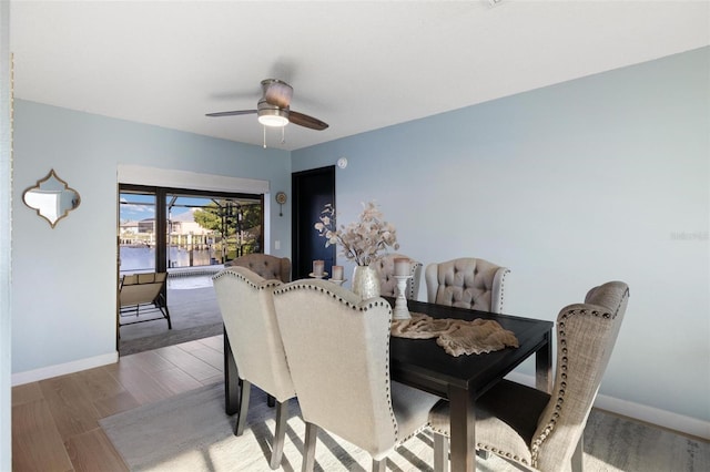 5140 Administration St, Port Charlotte, FL 33948 - dining area featuring a ceiling fan, baseboards, and wood finished floors
