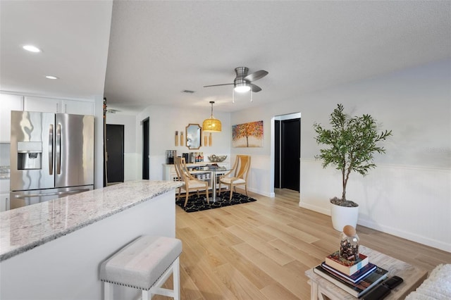 5140 Administration St, Port Charlotte, FL 33948 - living area featuring light wood finished floors, ceiling fan, recessed lighting, and baseboards