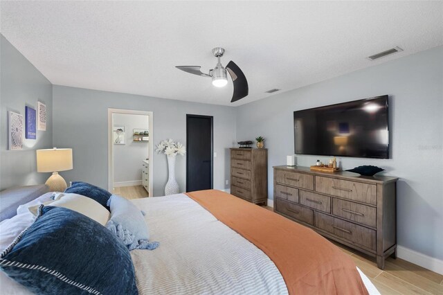 5140 Administration St, Port Charlotte, FL 33948 - bedroom with baseboards, a ceiling fan, and connected bathroom
