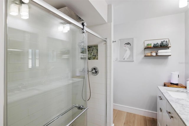5140 Administration St, Port Charlotte, FL 33948 - full bath featuring a shower stall, vanity, wood finished floors, and baseboards