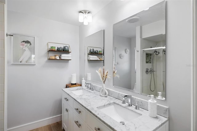 5140 Administration St, Port Charlotte, FL 33948 - bathroom with double vanity, a tile shower, and wood finished floors