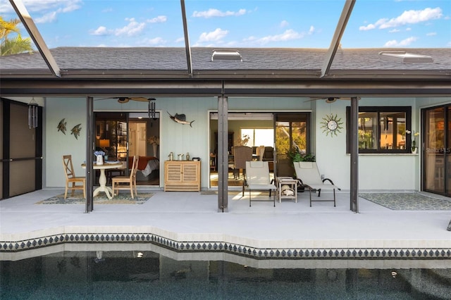5140 Administration St, Port Charlotte, FL 33948 - rear view of house with a patio area, an outdoor pool, glass enclosure, and a ceiling fan