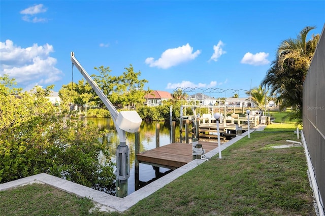 5140 Administration St, Port Charlotte, FL 33948 - dock with a yard, boat lift, and a water view