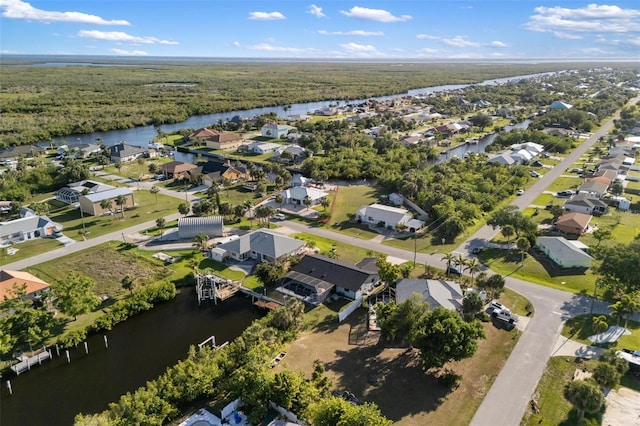 5140 Administration St, Port Charlotte, FL 33948 - aerial overview of property's location featuring a nearby body of water, nearby suburban area, and a forest