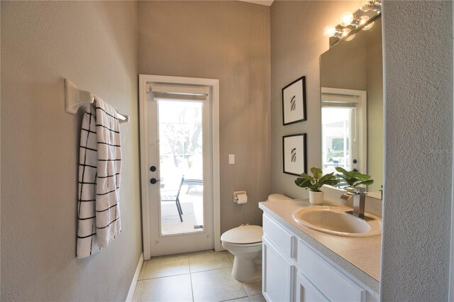 8209 Snowy Egret Pl, Bradenton, FL 34202 - bathroom with toilet, tile patterned floors, and vanity
