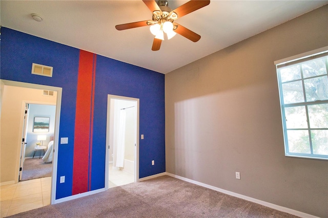 8209 Snowy Egret Pl, Bradenton, FL 34202 - unfurnished bedroom with multiple windows, baseboards, carpet floors, and a ceiling fan