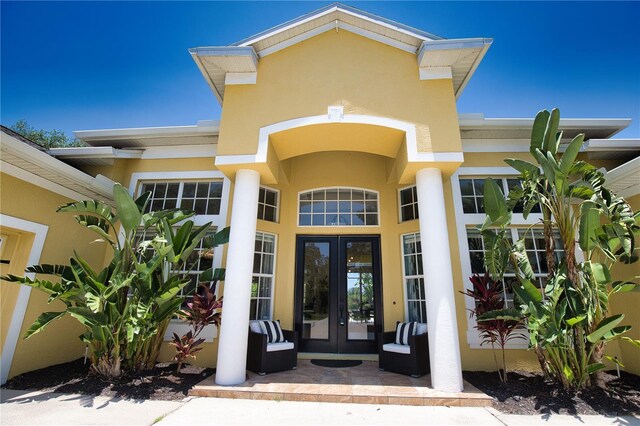 8209 Snowy Egret Pl, Bradenton, FL 34202 - entrance to property featuring french doors and stucco siding
