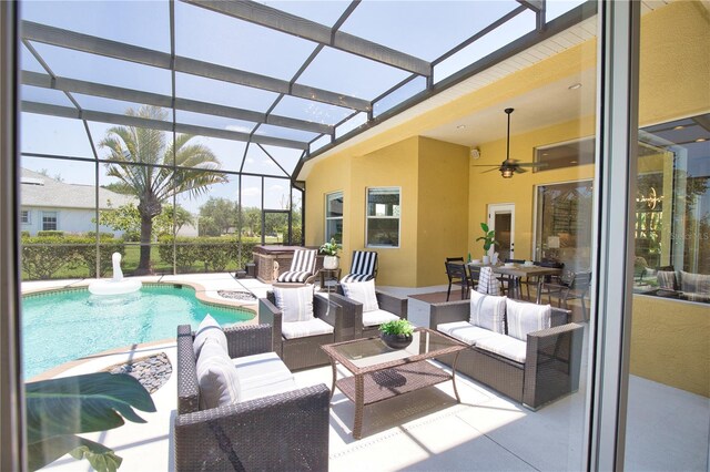 8209 Snowy Egret Pl, Bradenton, FL 34202 - swimming pool featuring outdoor lounge area, a patio area, a hot tub, a ceiling fan, and a lanai