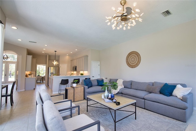 8209 Snowy Egret Pl, Bradenton, FL 34202 - living area with a chandelier, recessed lighting, french doors, light tile patterned floors, and baseboards
