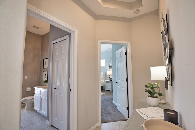 8209 Snowy Egret Pl, Bradenton, FL 34202 - hallway with light tile patterned floors