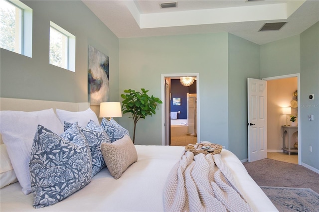 8209 Snowy Egret Pl, Bradenton, FL 34202 - carpeted bedroom with baseboards and ensuite bathroom