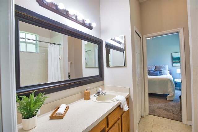 8209 Snowy Egret Pl, Bradenton, FL 34202 - ensuite bathroom with tile patterned flooring, vanity, and curtained shower