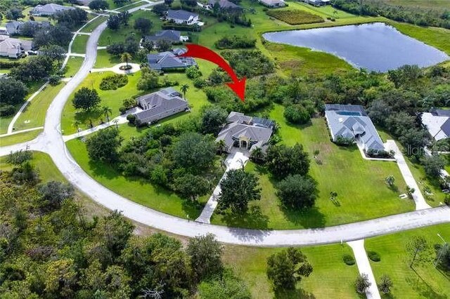 8209 Snowy Egret Pl, Bradenton, FL 34202 - aerial view of property and surrounding area featuring a large body of water and nearby suburban area