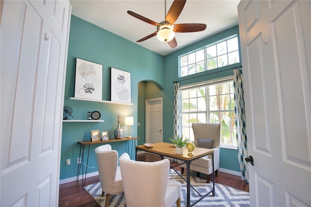 8209 Snowy Egret Pl, Bradenton, FL 34202 - office area featuring a ceiling fan, baseboards, wood finished floors, and arched walkways