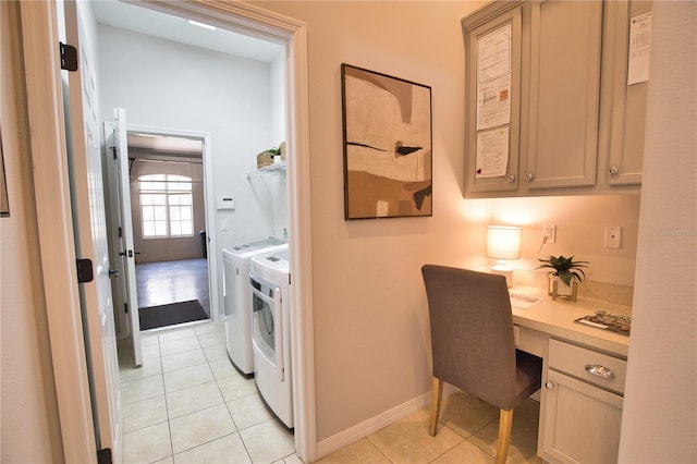 8209 Snowy Egret Pl, Bradenton, FL 34202 - laundry area featuring washer and clothes dryer, light tile patterned flooring, an office area, and baseboards