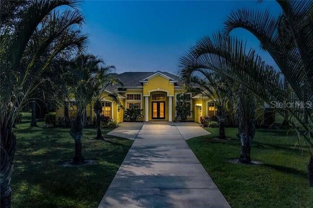 8209 Snowy Egret Pl, Bradenton, FL 34202 - view of front of home with a front yard and stucco siding