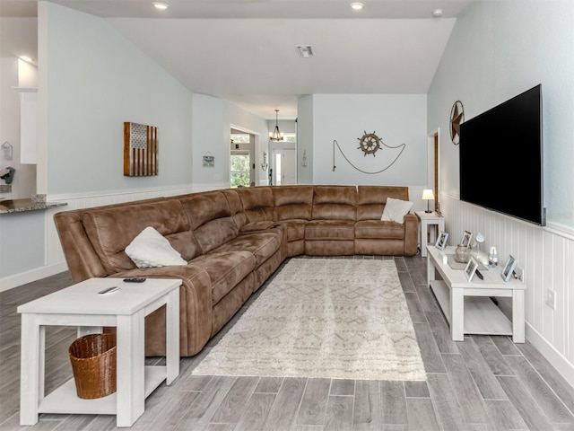 460 Bard Rd, Venice, FL 34293 - living area featuring wood finished floors, wainscoting, recessed lighting, and vaulted ceiling