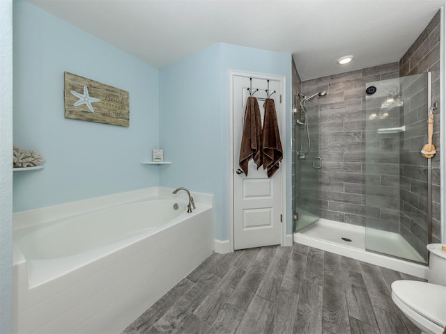 460 Bard Rd, Venice, FL 34293 - full bath featuring a bath, a shower stall, wood finished floors, toilet, and recessed lighting