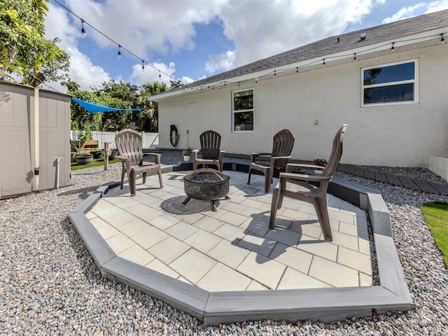460 Bard Rd, Venice, FL 34293 - view of patio / terrace with a fire pit and an outbuilding