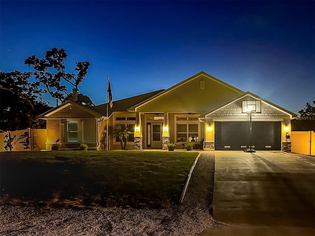 460 Bard Rd, Venice, FL 34293 - view of front of home featuring concrete driveway, a garage, and stone siding