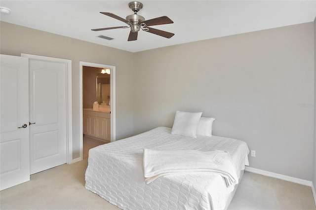 1104 Auburn Cove Cir, Venice, FL 34292 - bedroom with light colored carpet, ensuite bath, baseboards, and a ceiling fan