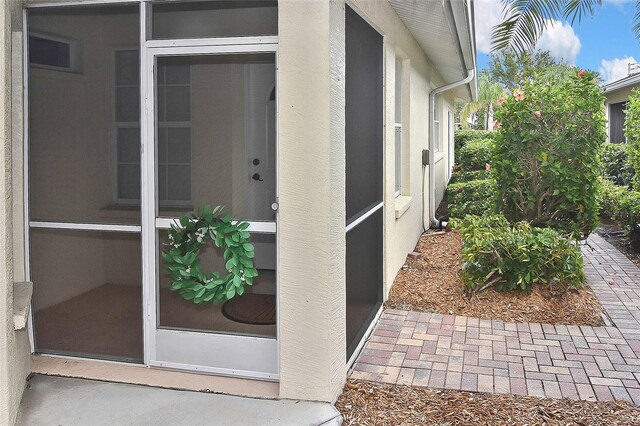 1104 Auburn Cove Cir, Venice, FL 34292 - property entrance with stucco siding