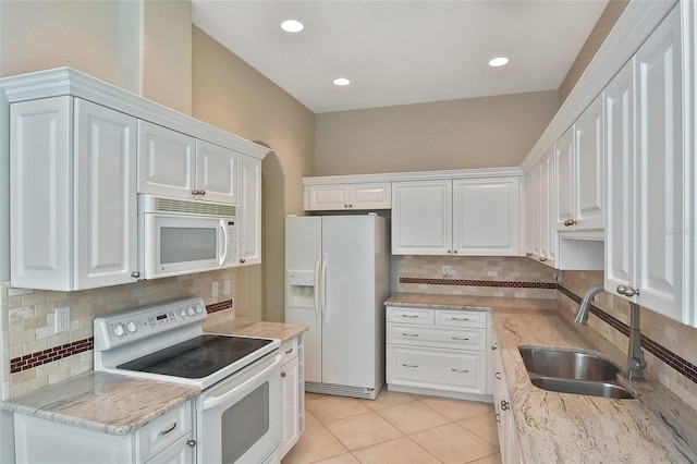 1104 Auburn Cove Cir, Venice, FL 34292 - kitchen with white appliances, a sink, decorative backsplash, white cabinets, and recessed lighting