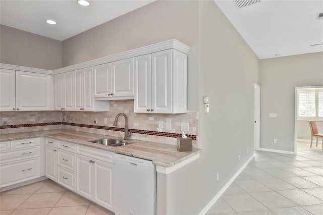 1104 Auburn Cove Cir, Venice, FL 34292 - kitchen with dishwasher, a sink, light tile patterned floors, decorative backsplash, and recessed lighting