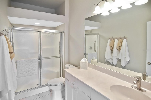 1104 Auburn Cove Cir, Venice, FL 34292 - bathroom featuring tile patterned flooring, a stall shower, vanity, and toilet