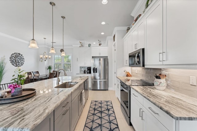 209 E Venice Ave, Venice, FL 34285 - kitchen with stainless steel appliances, a sink, crown molding, recessed lighting, and tasteful backsplash