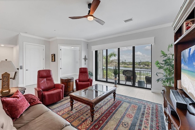 209 E Venice Ave, Venice, FL 34285 - tiled living room featuring ceiling fan, ornamental molding, and baseboards