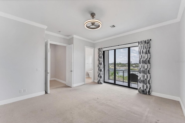 209 E Venice Ave, Venice, FL 34285 - unfurnished bedroom with access to outside, carpet flooring, baseboards, ornamental molding, and ensuite bath