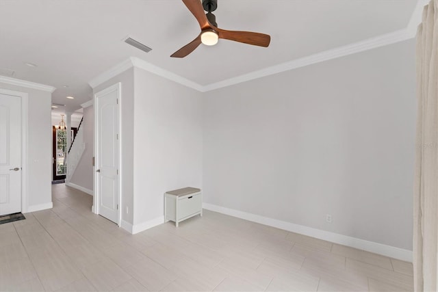 209 E Venice Ave, Venice, FL 34285 - unfurnished room featuring crown molding, stairs, ceiling fan, and baseboards