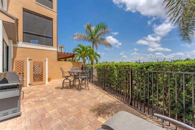 209 E Venice Ave, Venice, FL 34285 - view of patio / terrace featuring outdoor dining space and a grill