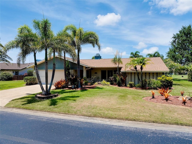915 S Doral Ln, Venice, FL 34293 - ranch-style home featuring driveway, a front lawn, an attached garage, and a chimney