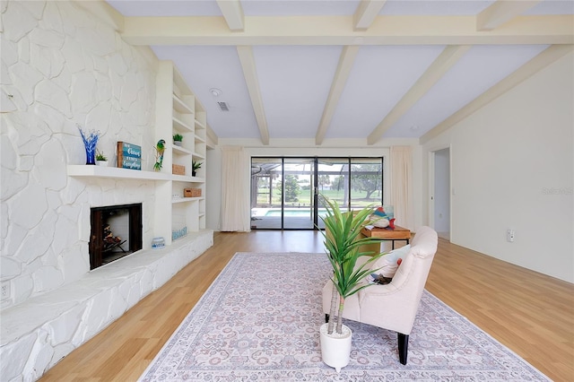 915 S Doral Ln, Venice, FL 34293 - living room with wood finished floors and a stone fireplace