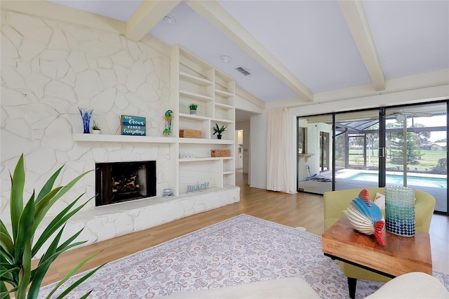 915 S Doral Ln, Venice, FL 34293 - living area with wood finished floors and a large fireplace