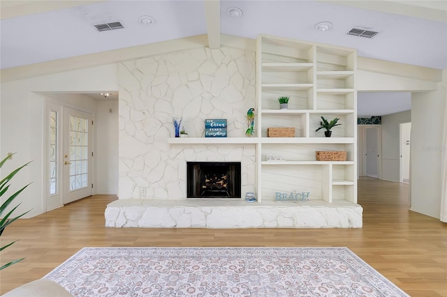 915 S Doral Ln, Venice, FL 34293 - living room featuring wood finished floors and a fireplace