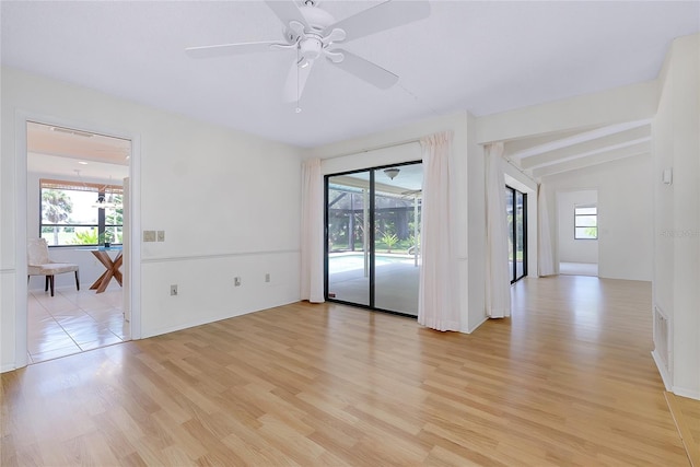 915 S Doral Ln, Venice, FL 34293 - spare room featuring healthy amount of natural light, light wood finished floors, and ceiling fan