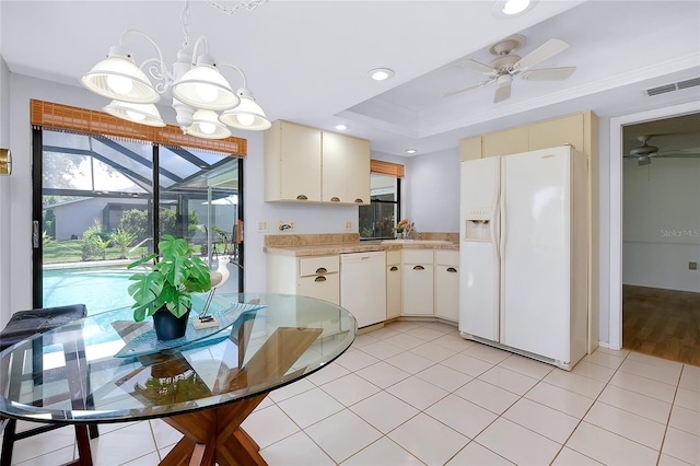 915 S Doral Ln, Venice, FL 34293 - kitchen with white appliances, ceiling fan, light countertops, decorative light fixtures, and cream cabinets