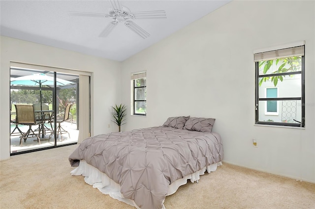915 S Doral Ln, Venice, FL 34293 - bedroom featuring vaulted ceiling, carpet flooring, access to outside, and multiple windows