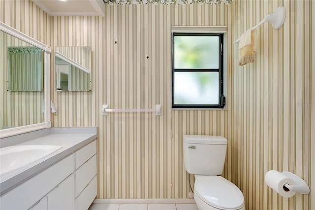 915 S Doral Ln, Venice, FL 34293 - bathroom with wallpapered walls, vanity, toilet, and tile patterned flooring