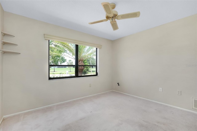 915 S Doral Ln, Venice, FL 34293 - spare room with light carpet, baseboards, and a ceiling fan