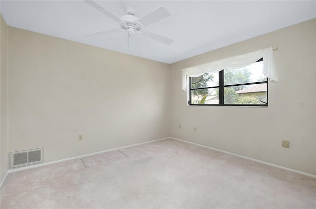 915 S Doral Ln, Venice, FL 34293 - spare room with light colored carpet, baseboards, and ceiling fan