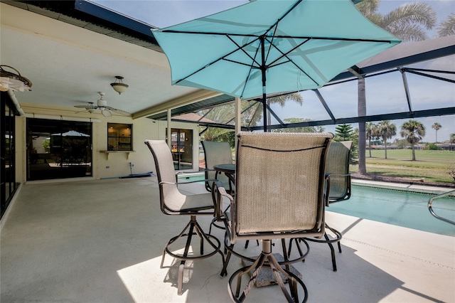 915 S Doral Ln, Venice, FL 34293 - view of patio / terrace with a ceiling fan, glass enclosure, and an outdoor pool
