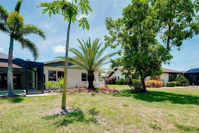 915 S Doral Ln, Venice, FL 34293 - view of grassy yard featuring a lanai