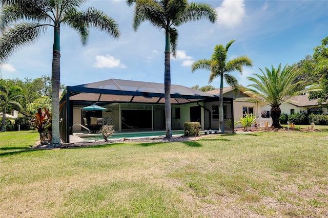 915 S Doral Ln, Venice, FL 34293 - back of property featuring a lawn, an outdoor pool, a lanai, and a patio